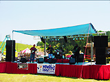Memphis stage with flat shade roof